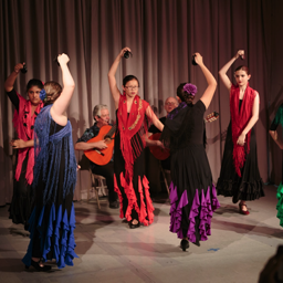 6 teens dancing Sevillanas with castanets, 2015 Recital. Photo: Eric Bandiero.