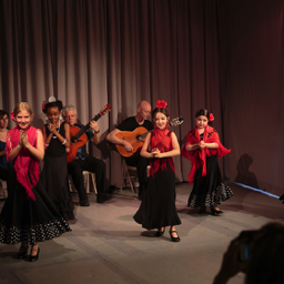 5 young girls doing palmas section of tangos flamencos at 2015 Recital, accompanied by 2 singers and 2 guitarists. Photo: Eric Bandiero.